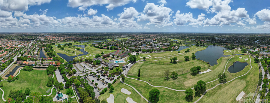 Aerial view of golf course and surrounding neighborhood